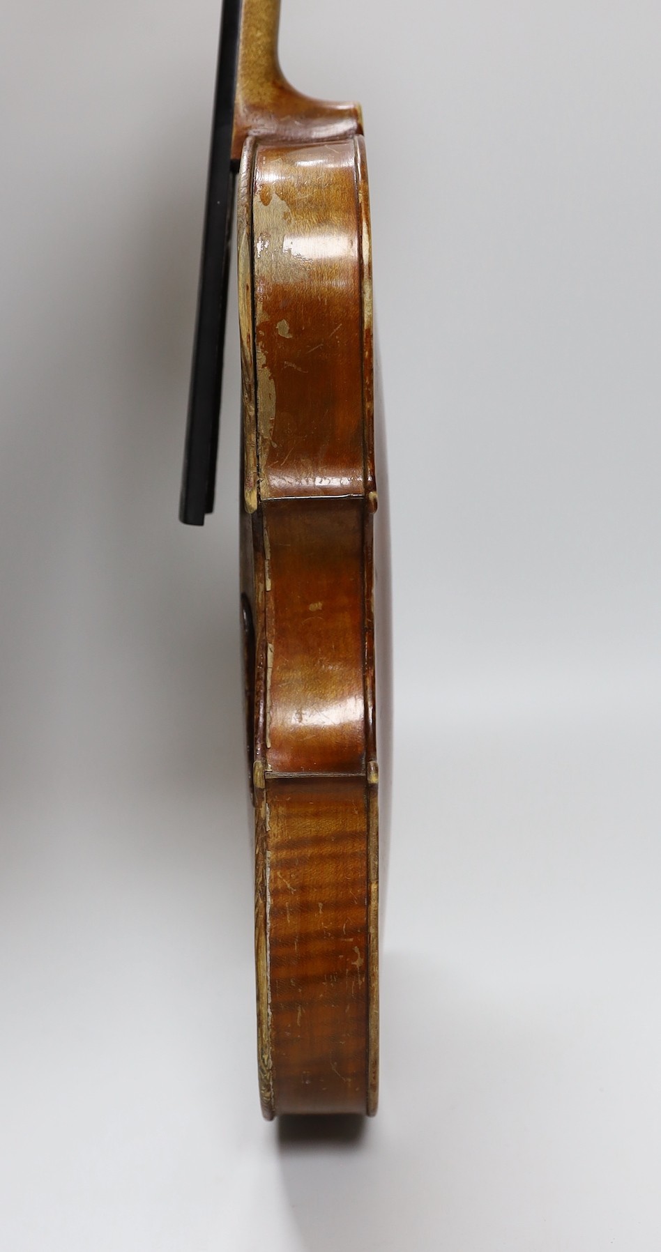 A cased three quarter size violin, labelled E.Coiffier, 56cms long